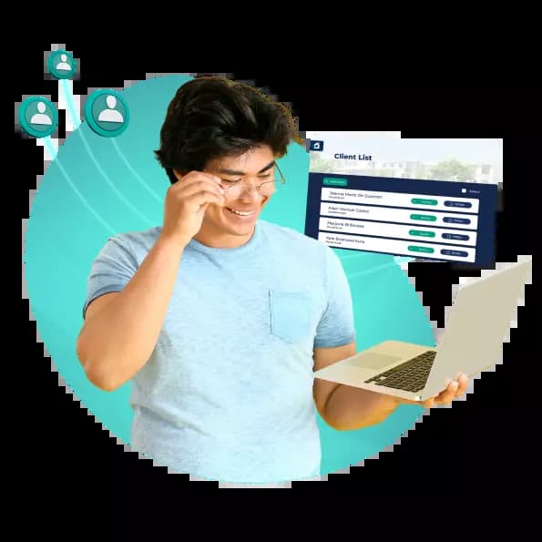 Blue shirt guy holding laptop